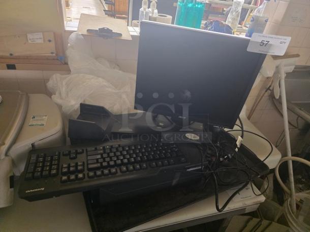 Computer set with Acer monitor and Sharkoon keyboard, in used condition. Connected cables and auction tag visible.