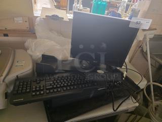 Computer set with Acer monitor and Sharkoon keyboard, in used condition. Connected cables and auction tag visible.