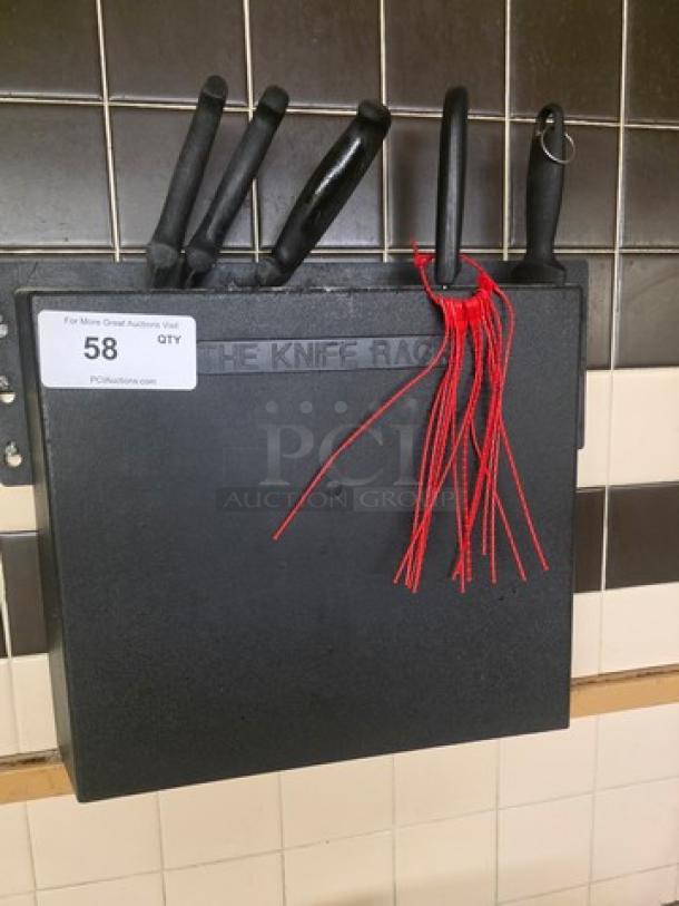 Knife rack with five black-handled knives mounted on a tiled wall; labeled "The Knife Rack" with auction tag "58."