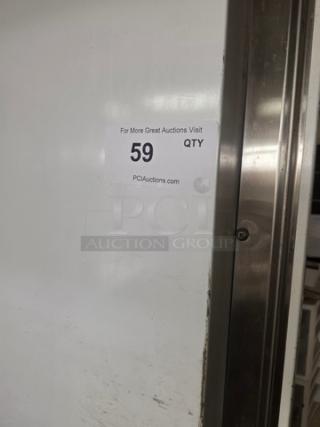 Walk-in cooler door with hardware included, intact condition. Label reads "For More Great Auctions Visit, 59 QTY, PCIAuctions.com".