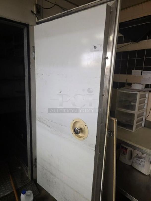 Walk-in cooler door with hardware included. White exterior, metal frame, round handle. Buyer must remove. Door only.
