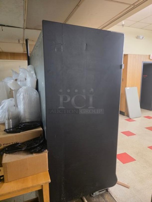 Hill Phoenix ONRZ3 frozen food display case, three glass doors, narrow depth, standard height, side view, used condition.