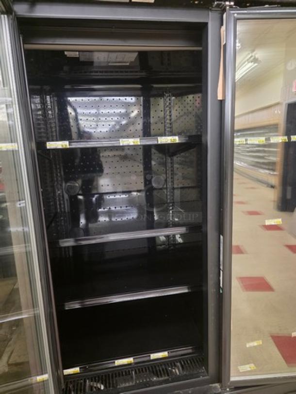 Hill Phoenix ONRZ3 narrow depth 3-door glass display case, for frozen food; good condition, shelves intact. Buyer must remove.