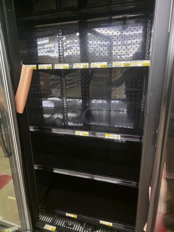 Hill Phoenix ONRZ3 glass door, reach-in frozen food display case with 3 doors, narrow depth, standard height, in good condition.