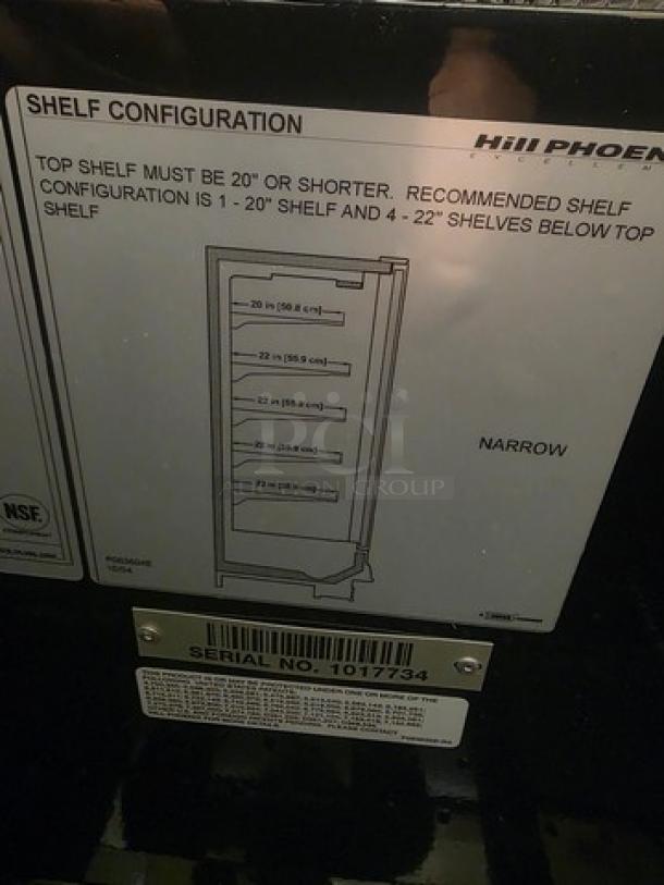 Hill Phoenix ONRZ3 3-door display case with shelf configuration label indicating "Narrow" and serial no. 1017734.