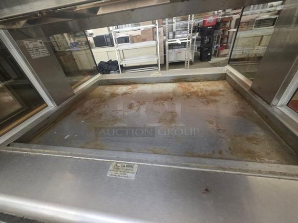 Henny Penny HMI-103 heated food table, stainless steel, 60 Hz, 1 PH, 120/208V, visible wear, manufacturer's label present.