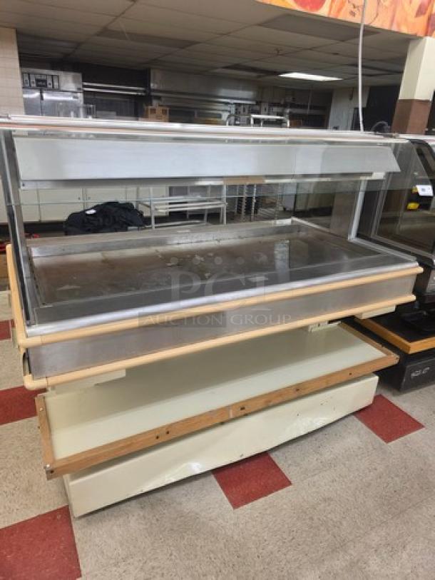 Henny Penny HMI-105 hot food case, 120/208V, 60 Hz, 1 PH. Stainless steel frame with glass display, used condition.