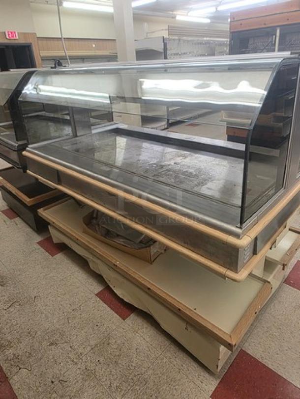 Henny Penny HMI-105 Hot Food Case, 120/208V, 60 Hz, 1 PH, glass display, stainless steel frame, wood trim, used condition.