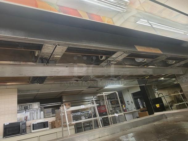 Henny Penny HMI-105 Hot Food Case, 120/208V, 60 Hz, 1 PH. Stainless steel, good condition, commercial kitchen setting.