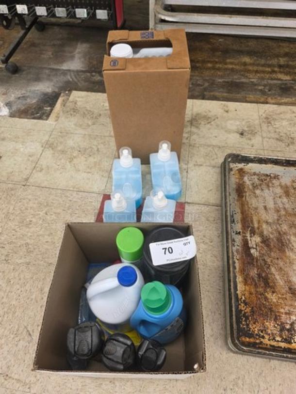 Box of assorted cleaning products, including soaps, detergents, and sprays. Various brands and bottles visible. Condition appears new.