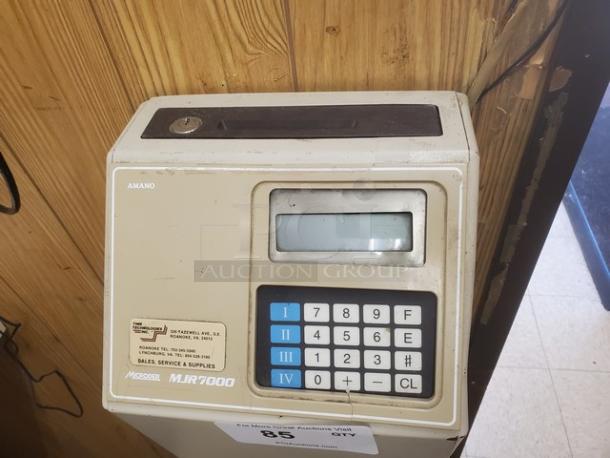 Amano MJR-7000 Calculating Time Clock, beige, shows numeric keypad and display; some wear visible.