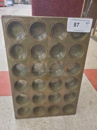Lot of 3 muffin or cupcake baking pans, metal, 24 cups each, used condition, auction tag with quantity 3, item marked as 87.
