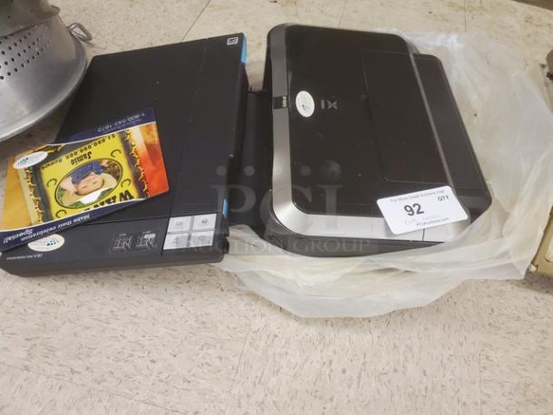 Epson Perfection V30 scanner and Canon PIXMA iP4820 printer, auction lot, gently used condition, includes sale tag.