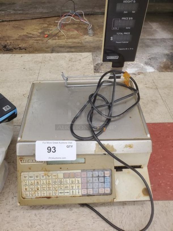 Hobart SP1500 Commercial Digital Scale with Printer, visible wear, keypad, and display, ideal for retail use.