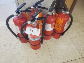 Lot of 5 red fire extinguishers with black handles and hoses, tags visible; suitable for safety needs.