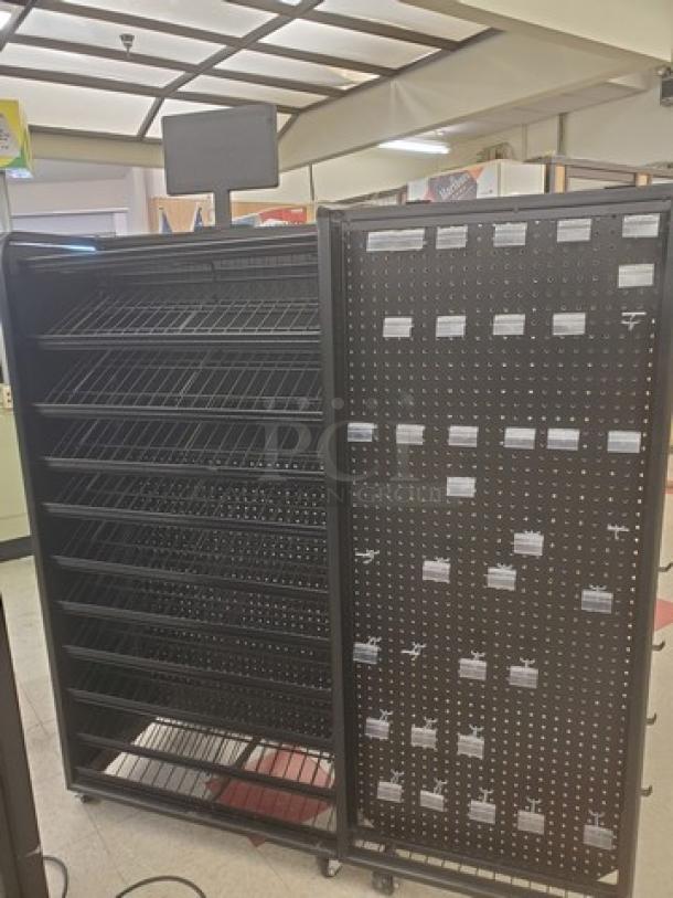 Checklane shelving unit with multiple angled metal shelves and perforated panel. Includes attached digital display. Good condition.