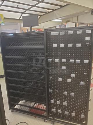 Checklane shelving unit with multiple angled metal shelves and perforated panel. Includes attached digital display. Good condition.