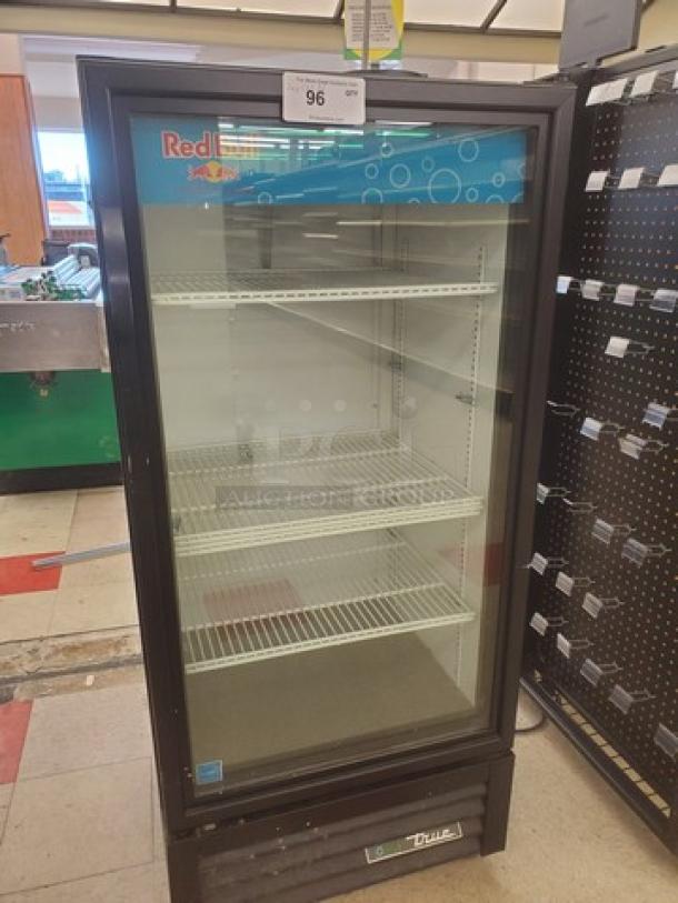 True GDM-10-HC~TSL01 glass door merchandiser, 24 7/8" width, one section, three adjustable shelves, clean condition, "True" logo visible.
