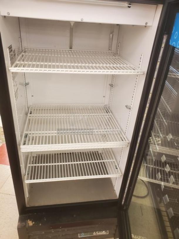 True GDM-10-HC~TSL01 one-section glass door merchandiser, black exterior, three wire shelves, clean condition, model tag visible.