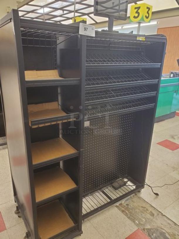 Steel checklane shelving unit with multiple wire shelves and wooden base inserts. Black finish, used condition, item number 97.