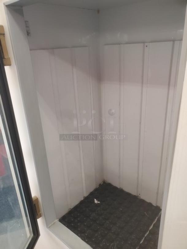 Leer Indoor Ice Merchandiser, model M1000AGR404. Features interior shelving, glass door; appears in good condition.