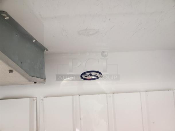 Leer Indoor Ice Merchandiser, Model M1000AGR404, showing interior with a visible Amana label. Clean condition with minimal wear.