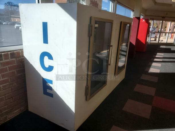 Leer Indoor Ice Merchandiser, model M1000AGR404, features a white exterior with "ICE" in blue, dual glass doors, used condition.