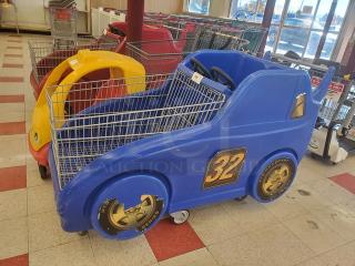 Blue racecar shopping cart with number 32, featuring playful design and wheels. Used condition, suitable for children's ride.