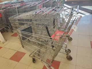 Lot of 5 metal shopping carts in good condition, with red handles and wheels, perfect for retail use.