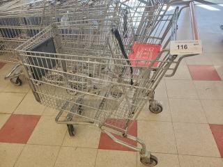 Lot of 5 metal shopping carts in used condition. Features wire mesh baskets and swivel wheels. Includes auction label with item number 116.