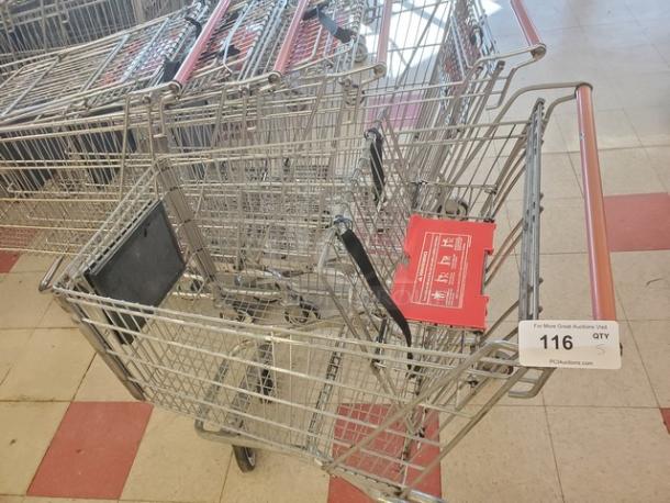 Lot of 5 metal shopping carts in good condition, each with red handles. Auction tag displays "116 QTY 5."