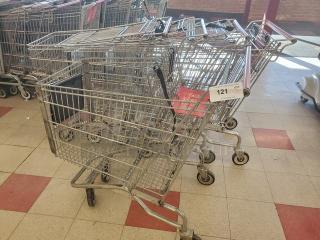 Lot of 5 metal shopping carts with swivel wheels in fair condition, labeled "121." Ideal for retail use.