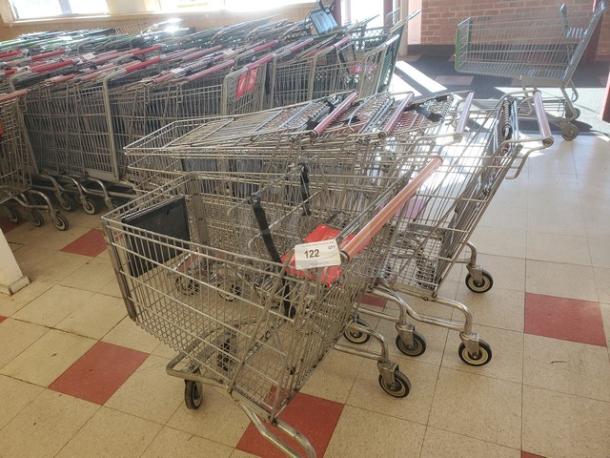Lot of 5 metal shopping carts in used condition, each with red handles. Label indicates item number 122.