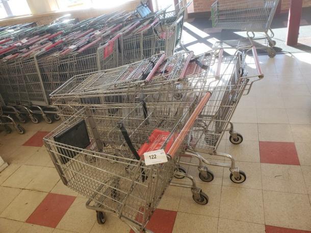 Lot of 5 shopping carts in good condition, metal frames, standard size, with visible handling bars, labeled 122.