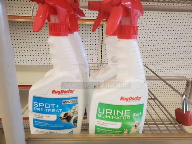 Lot of 16 Rug Doctor carpet cleaners with red spray nozzles. Includes Spot+ Pre-Treat and Urine Eliminator formulas.