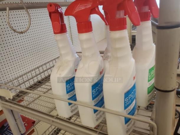 Lot of 16 carpet cleaner jugs with red spray nozzles. Features "Spot Pre-Treat" label. New condition.