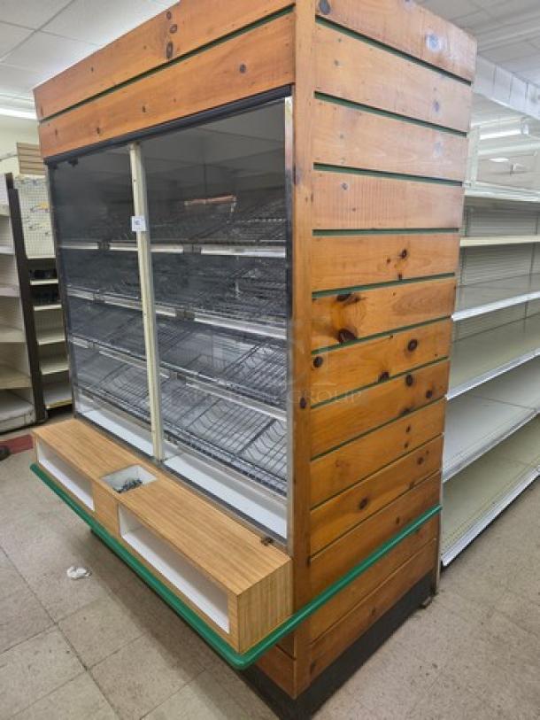 Wooden dry display case with glass front, metal shelving, and open bottom storage. Suitable for retail use. Good condition.