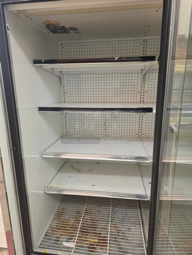 Kysor Warren 2 Door Low Temp Case, Model LV5H1-2U. Features adjustable shelving, glass doors. Suitable for commercial use.