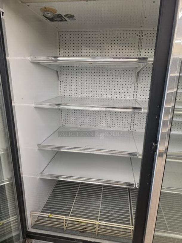Kysor/Warren freezer display case model LV5H1-5U, no compressor, shelves intact, fair condition, sold by the door.