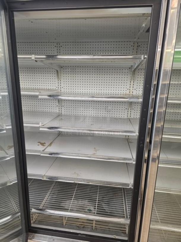 Kysor/Warren freezer display case, model LV5H1-5U, no compressor, metal shelves, used condition, sold by the door.