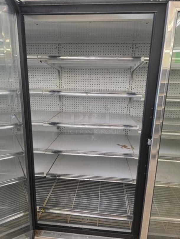 Kysor/Warren freezer display case, model LV5H1-5U, no compressor, sold by the door. Visible shelving, good condition.