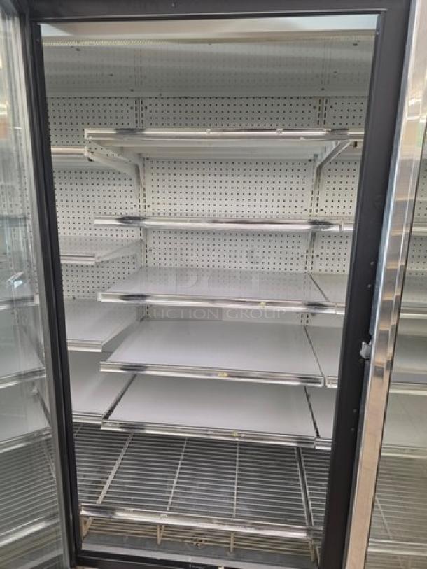 Kysor/Warren freezer display case model LV5H1-5U, no compressor, shelving intact, sold by the door.
