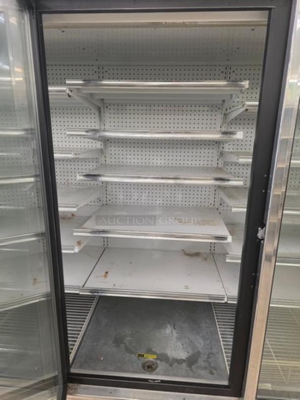 Kysor/Warren freezer display case model LV5H1-5U, no compressor, metal shelves, sold by the door, visible wear.