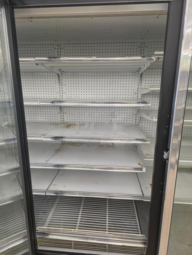Kysor/Warren freezer display case model LV5H1-5U, no compressor, sold by door. Multiple shelves, buyer removes.