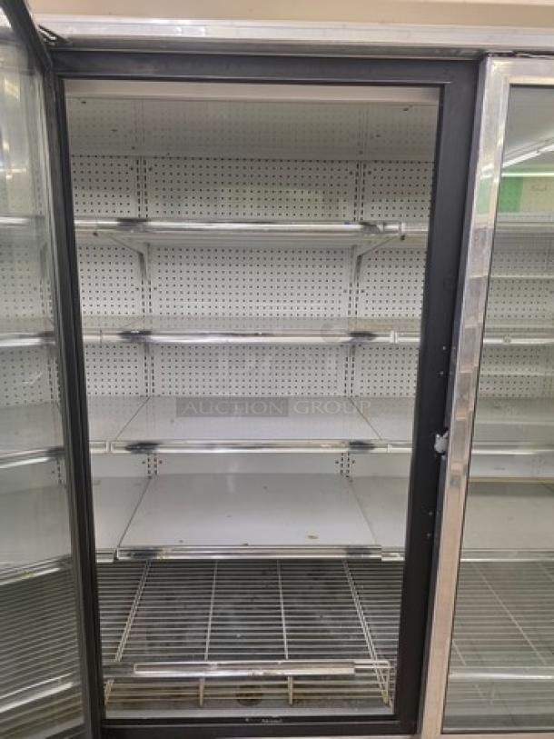 Kysor/Warren freezer display case model LV5H1-5U, no compressor, multiple shelves, glass doors, for sale without tools or removal service.