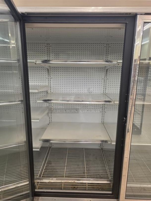 Kysor/Warren freezer display case model LV5H1-5U, glass door, metal shelves, no compressor, sold by the door, used condition.