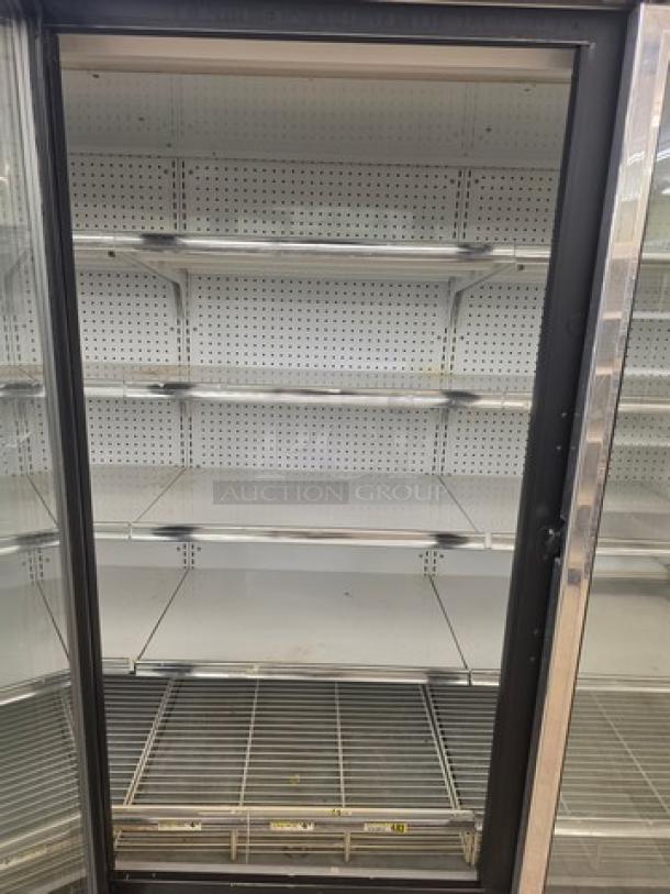 Kysor/Warren freezer display case model LV5H1-5U, no compressor, shelves intact, sold by the door, needs proper removal.