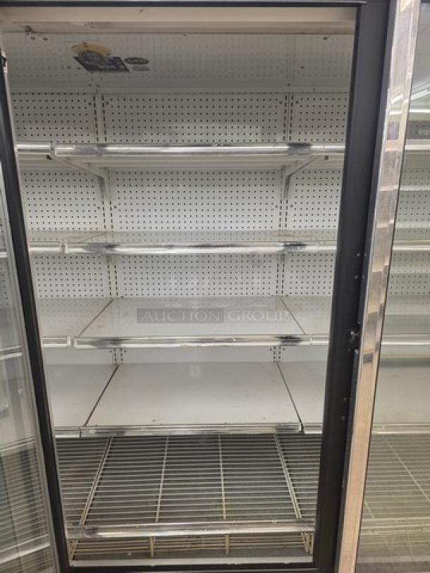 Kysor/Warren freezer display case model LV5H1-5U, glass front, multiple shelves, no compressor, sold by door.