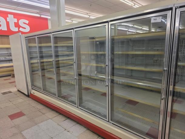 Hussmann Gel-5 frozen food doors with shelving, no compressor, stainless steel, sold by door. Buyer removes. 25 available.