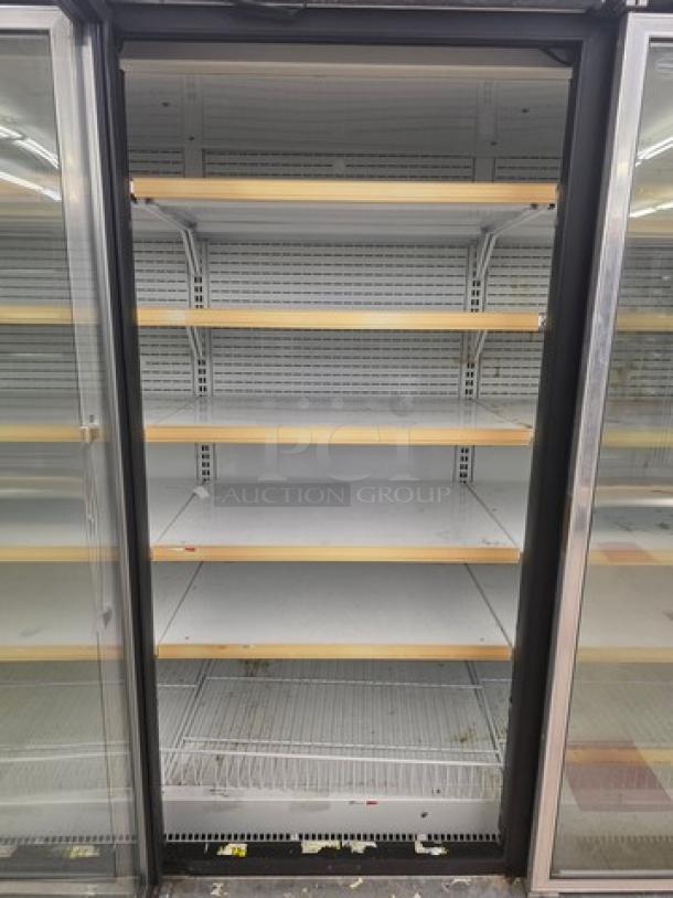 Hussmann Gel-5 frozen food door with shelving, no compressor, sold individually. Model Gel-5. Buyer handles removal.